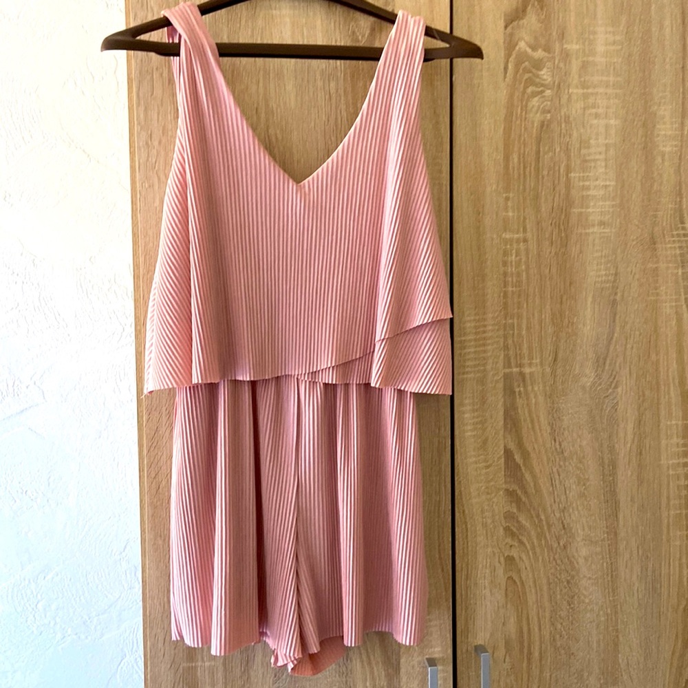 Pink romper.